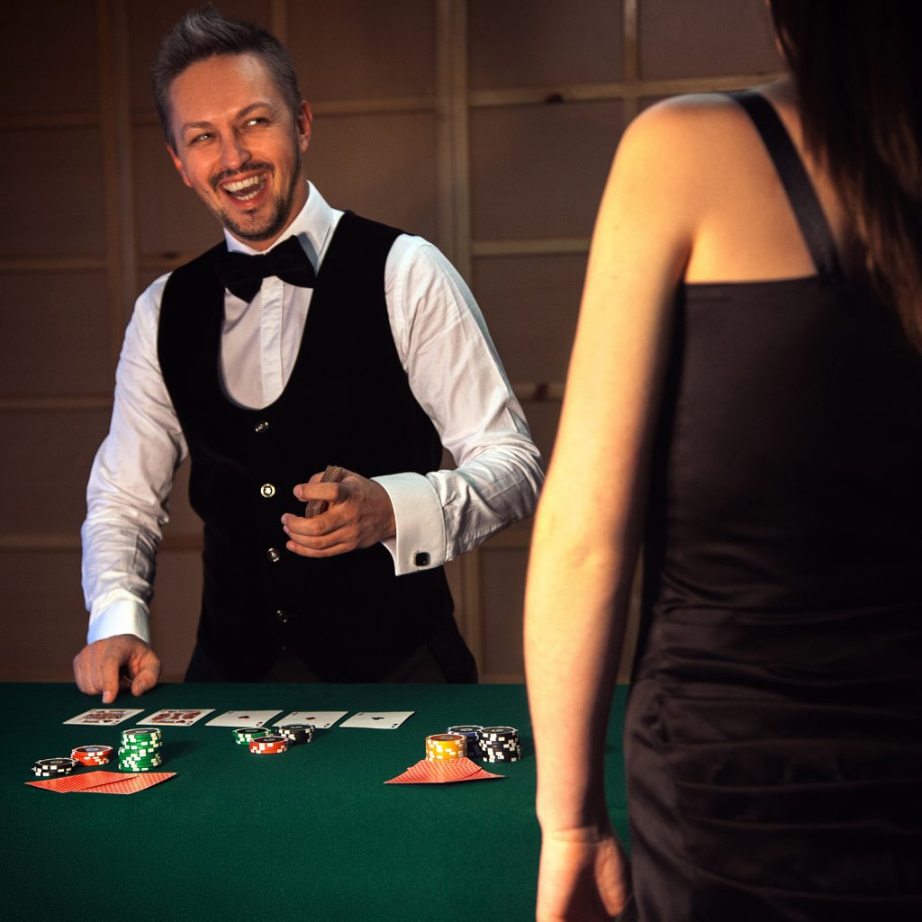 dealer deals the cards at a casino night party fundraiser